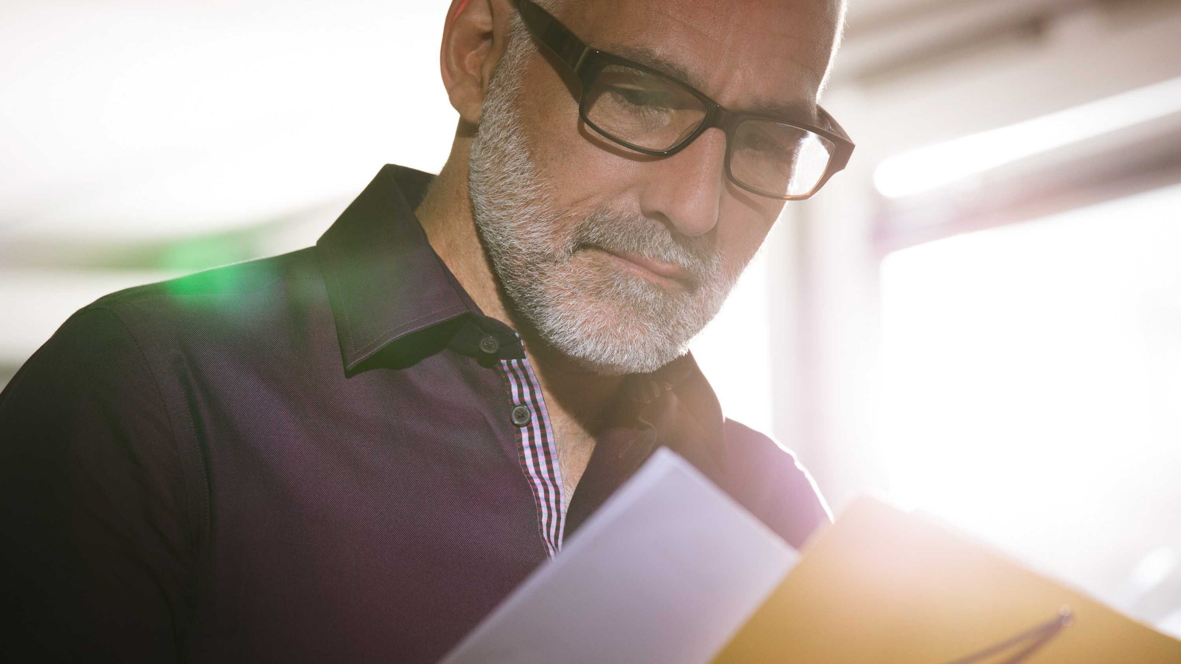 A man looking at documents.