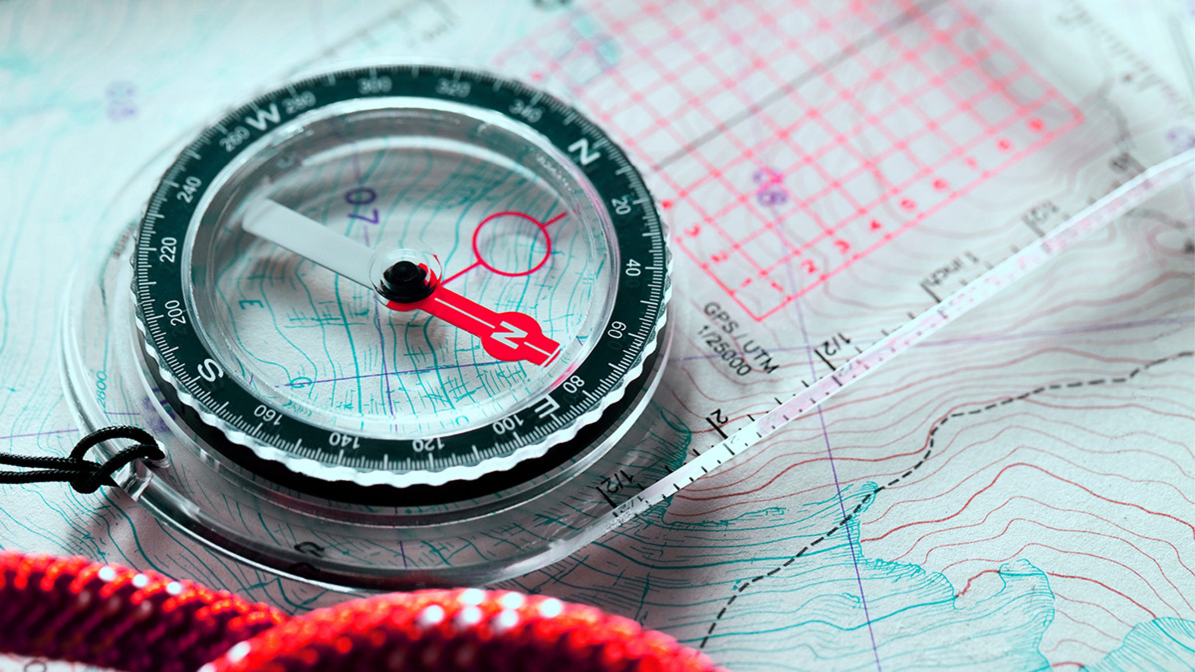 A picture of a compass with a map.