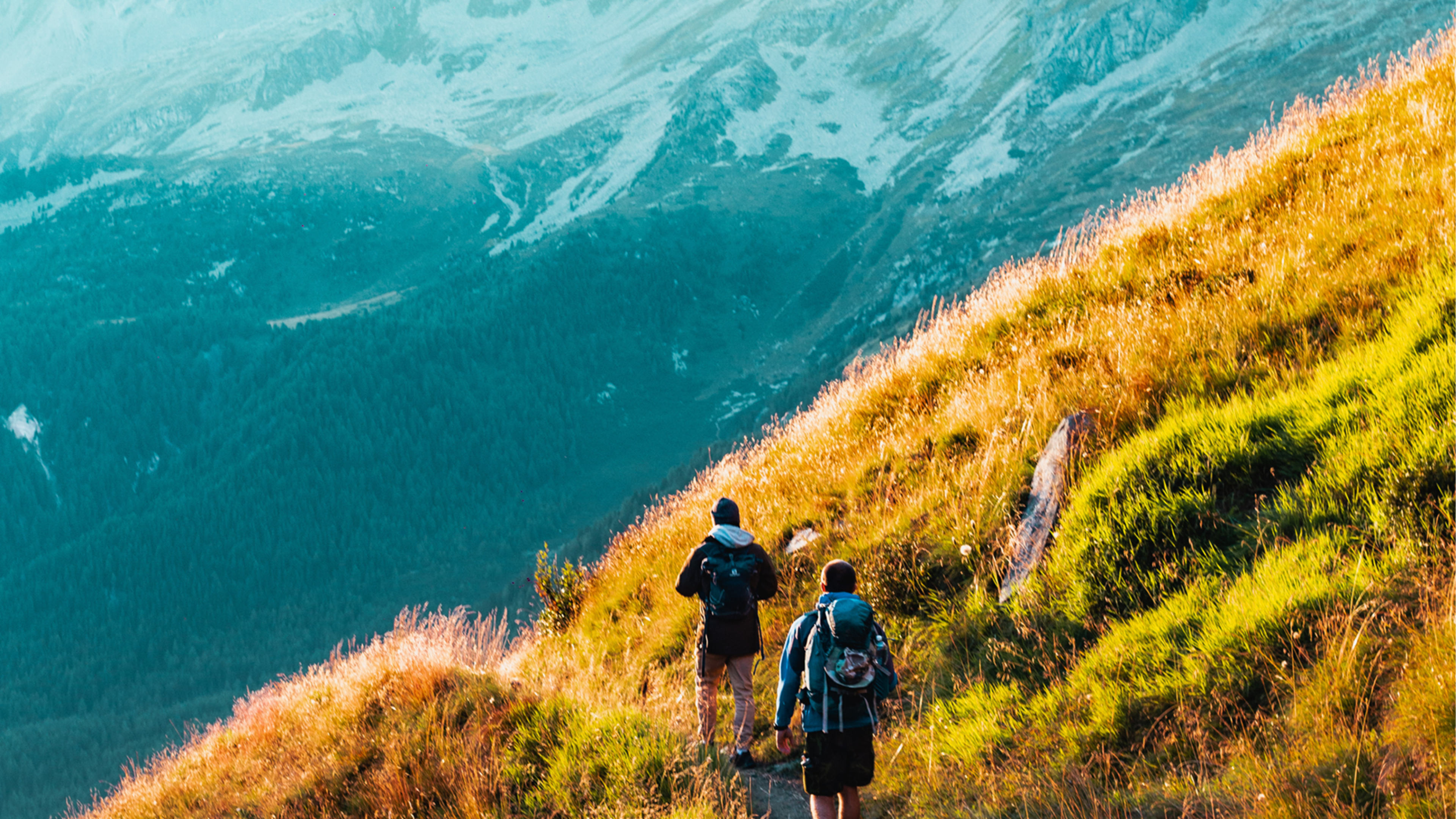 Two people hiking in the mountains.