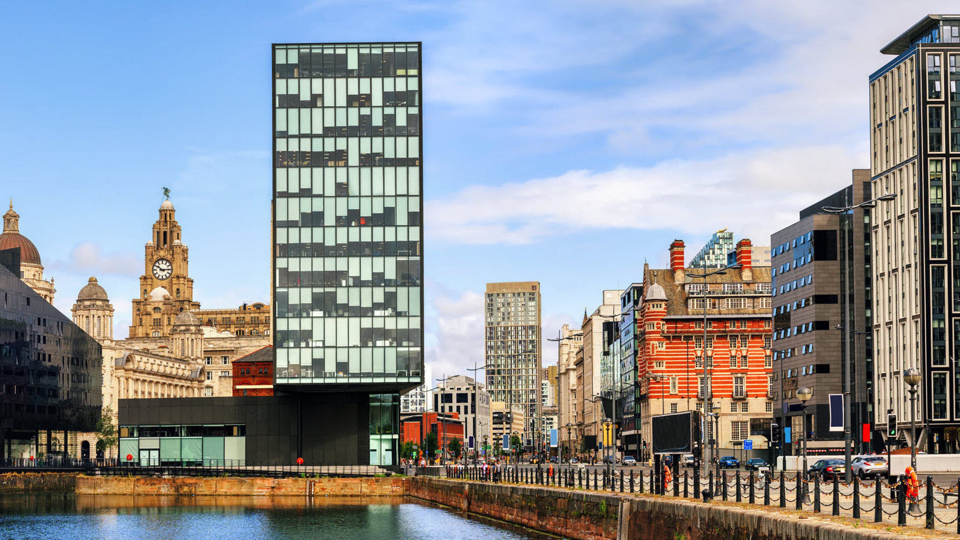 A skyline with houses by the water.