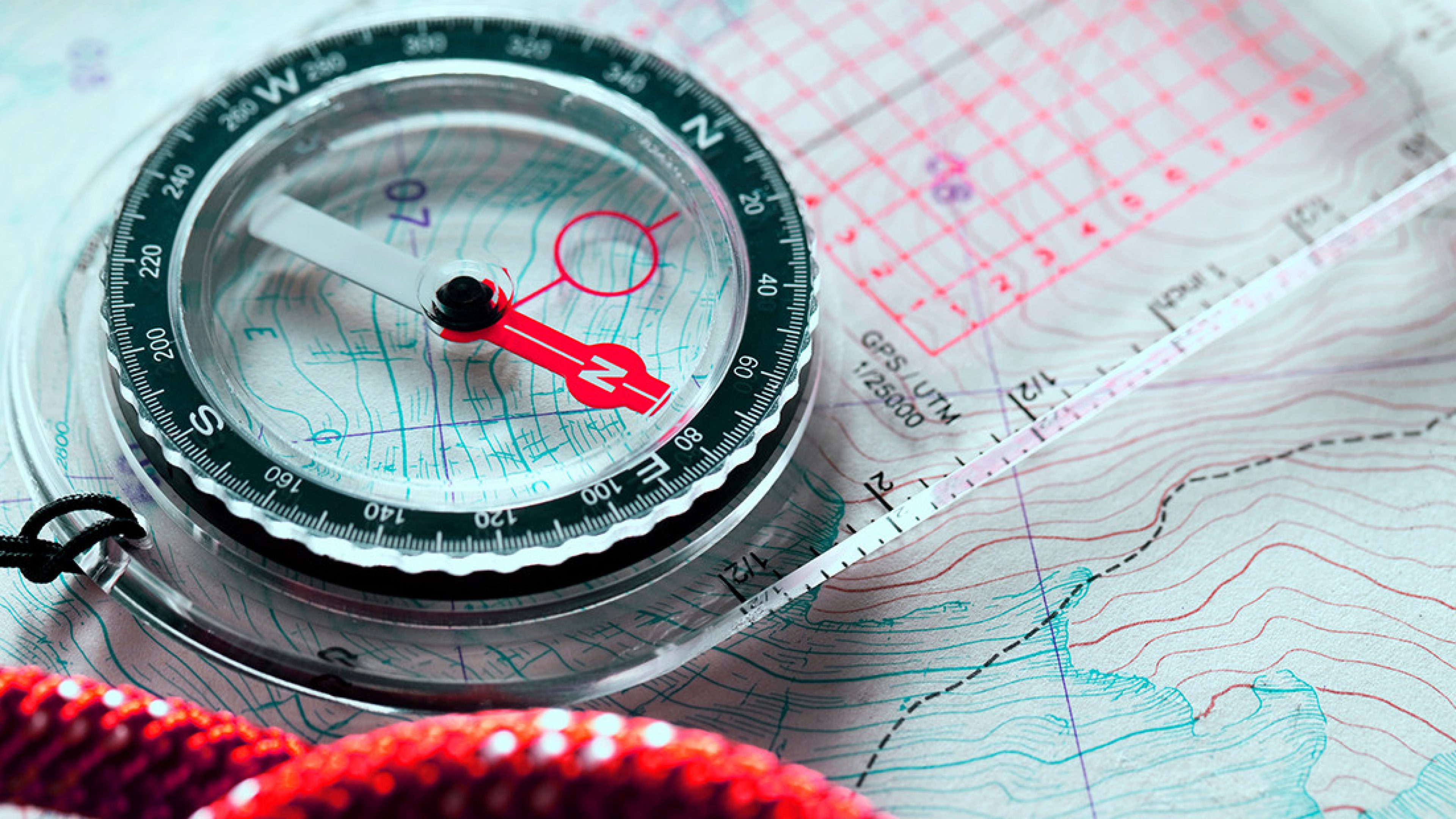 A picture of a compass with a map.