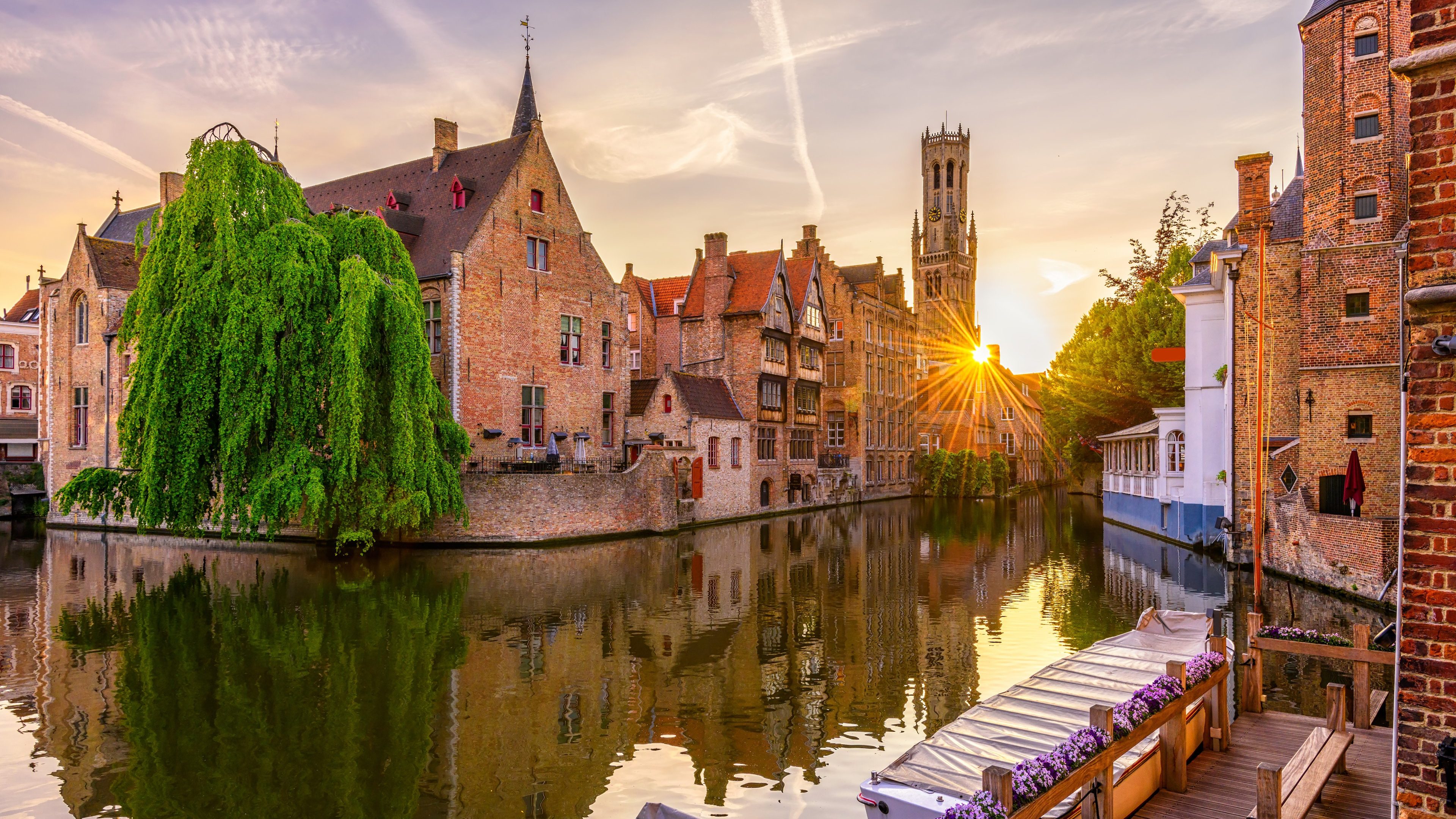 Classic view of the historic city center of Bruges (Brugge), West Flanders province, Belgium. Sunset cityscape of Bruges.