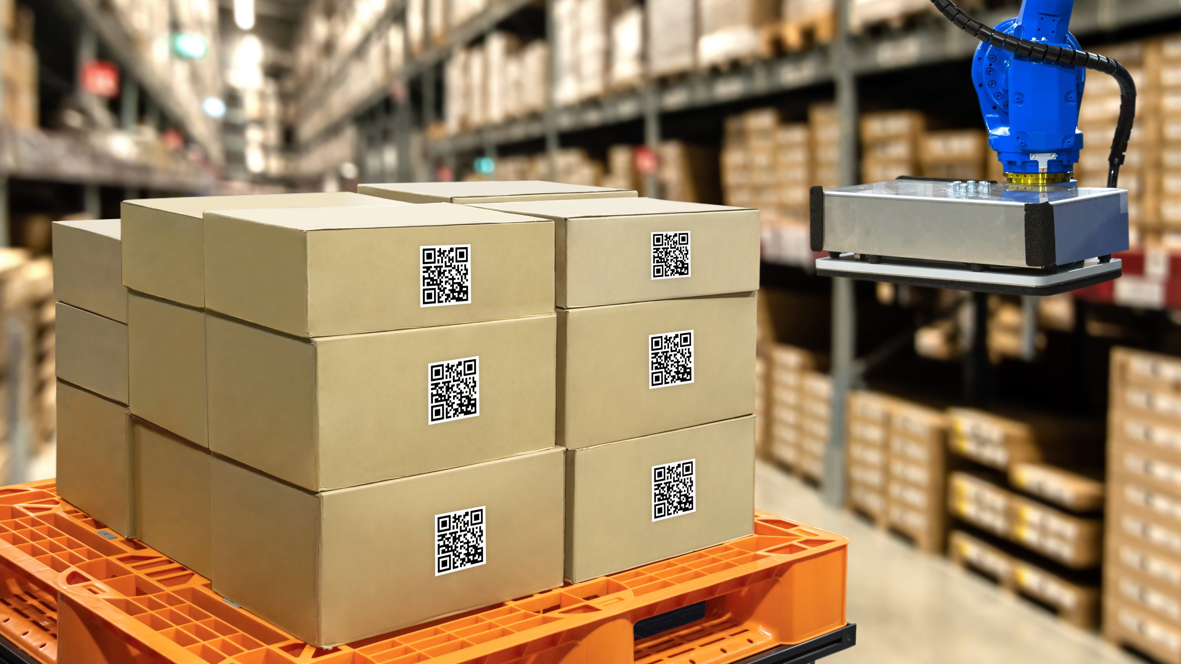 Smart logistic industry 4.0 , QR Codes Asset warehouse and inventory management supply chain technology concept. Group of boxes and Automation robot arm machine in storehouse