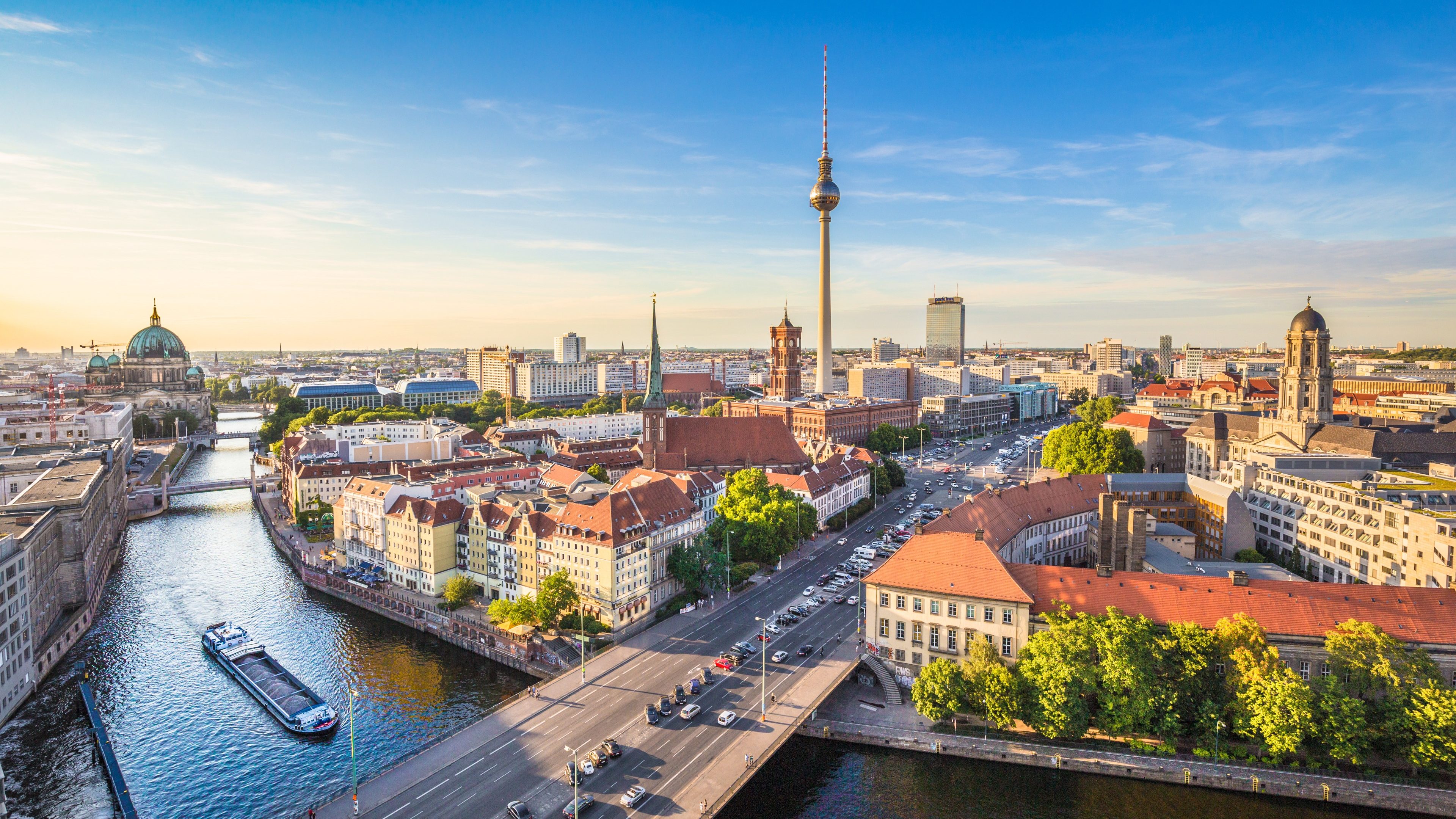 Berlin skyline panorama with TV tower and Spree river at sunset, Germany