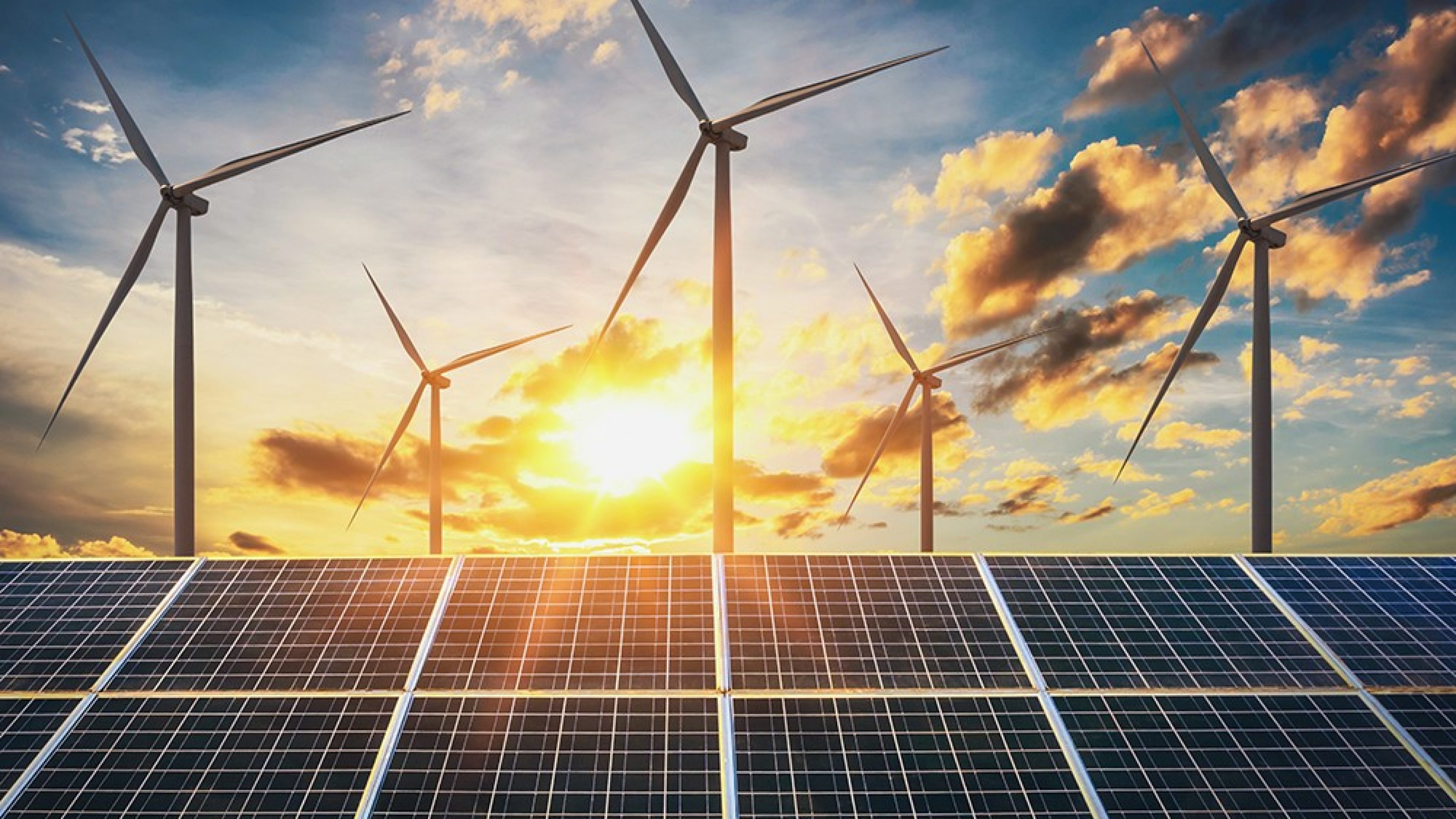 wind turbine with solar panels and sunset. concept clean energy